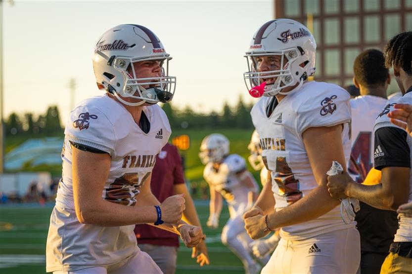 Student-athletes play football